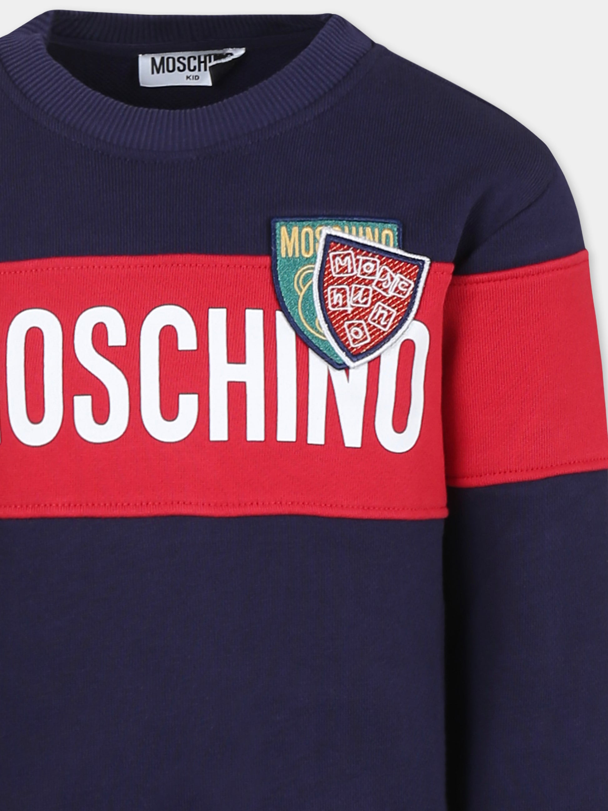 Completo blu per bambino con logo e stemmi,Moschino Kids,HUK03Z LCA77 40016